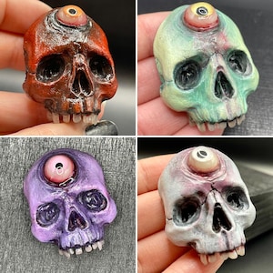 Third eye open, skull magnet.