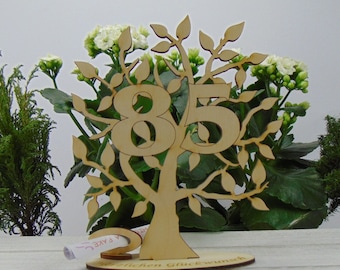 Tree with birthday number (anniversary number) 85 and engraved foot with congratulations