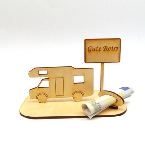 May include: Wooden cutout of a camper van with a sign that reads "Gute Reise" and a slot for a rolled-up bill of money.