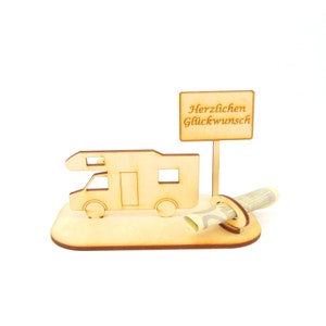 May include: Wooden camper van money holder with a sign that reads "Herzlichen Gl&uuml;ckwunsch" which translates to "Congratulations" in English. The money holder is designed to hold a rolled up bill of money.