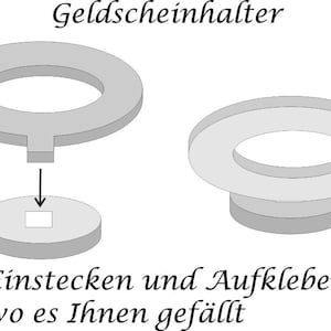 May include: A diagram showing how to use a gray plastic money holder. The holder is a ring with a small slot in the center. The instructions say to insert a bill into the slot and then stick the holder to a surface.