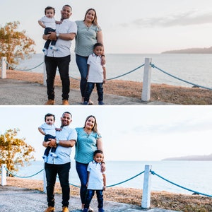 May include: A family of four standing on a boardwalk near a body of water. The parents are holding their two young sons. The father is wearing a blue and white plaid shirt, blue jeans, and brown shoes. The mother is wearing a teal shirt, blue jeans, and brown sandals. The older son is wearing a white shirt, blue jeans, and blue sneakers. The younger son is wearing a white shirt, blue jeans, and brown shoes.