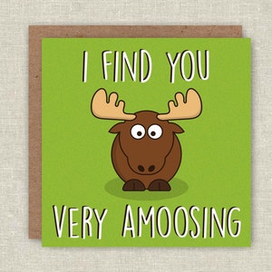 May include: A green card with a cartoon moose and the text "I find you very amoosing".