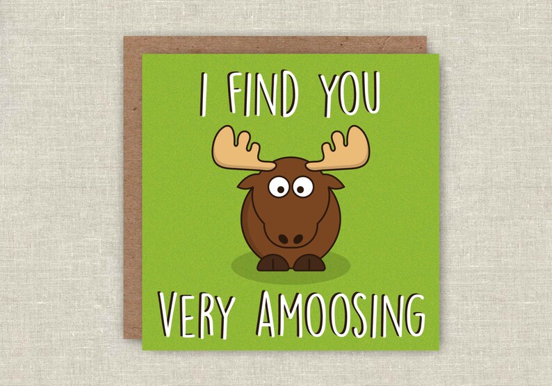 May include: A green card with a cartoon moose and the text "I find you very amoosing".