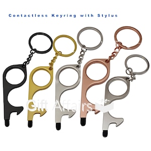 May include: Four keychains with a stylus and bottle opener. The keychains are black, gold, silver, and rose gold.