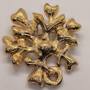 ungaro Paris Broche en métal de couleur or signé.