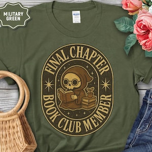 May include: Military green t-shirt with a graphic of a cartoon grim reaper reading a book, with the text "FINAL CHAPTER BOOK CLUB MEMBER" in a circular design. The shirt has a crew neck and short sleeves.