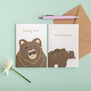 Mother's Day card illustration of mummy bear carrying baby bear on her back and Daddy bear card