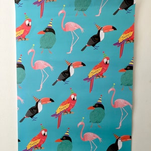 May include: A turquoise blue wrapping paper with a repeating pattern of colourful birds wearing party hats. The birds include a pink flamingo, a red and yellow parrot, a green bird, and a black and yellow toucan.