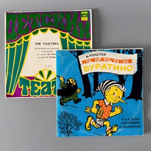 May include: Two vintage vinyl record album covers. One features a green, purple, and yellow design with Russian text. The other has a blue background with a cartoon illustration of a character with a long nose and a black and white striped hat, with Russian text.