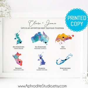 May include: A watercolor print with the text "Claire & Jamie, Life is an adventure best traveled together." The print features watercolor maps of England, Australia, Singapore, Peru, Scotland, and Bermuda with black hearts marking locations.