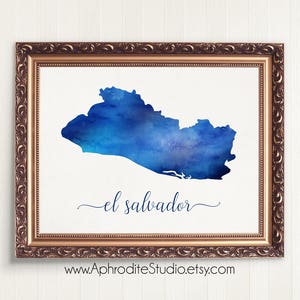 May include: A watercolor painting of El Salvador in shades of blue, framed in a gold ornate frame. The text "el salvador" is written in cursive below the map.