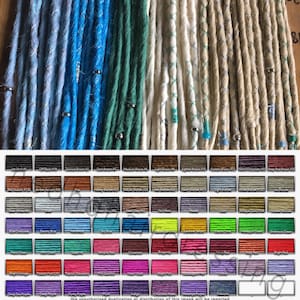 May include: A variety of synthetic dreadlock hair extensions in different colors, including black, brown, blonde, blue, green, red, and purple. The hair extensions are arranged in rows and are ready to be used for hair styling.