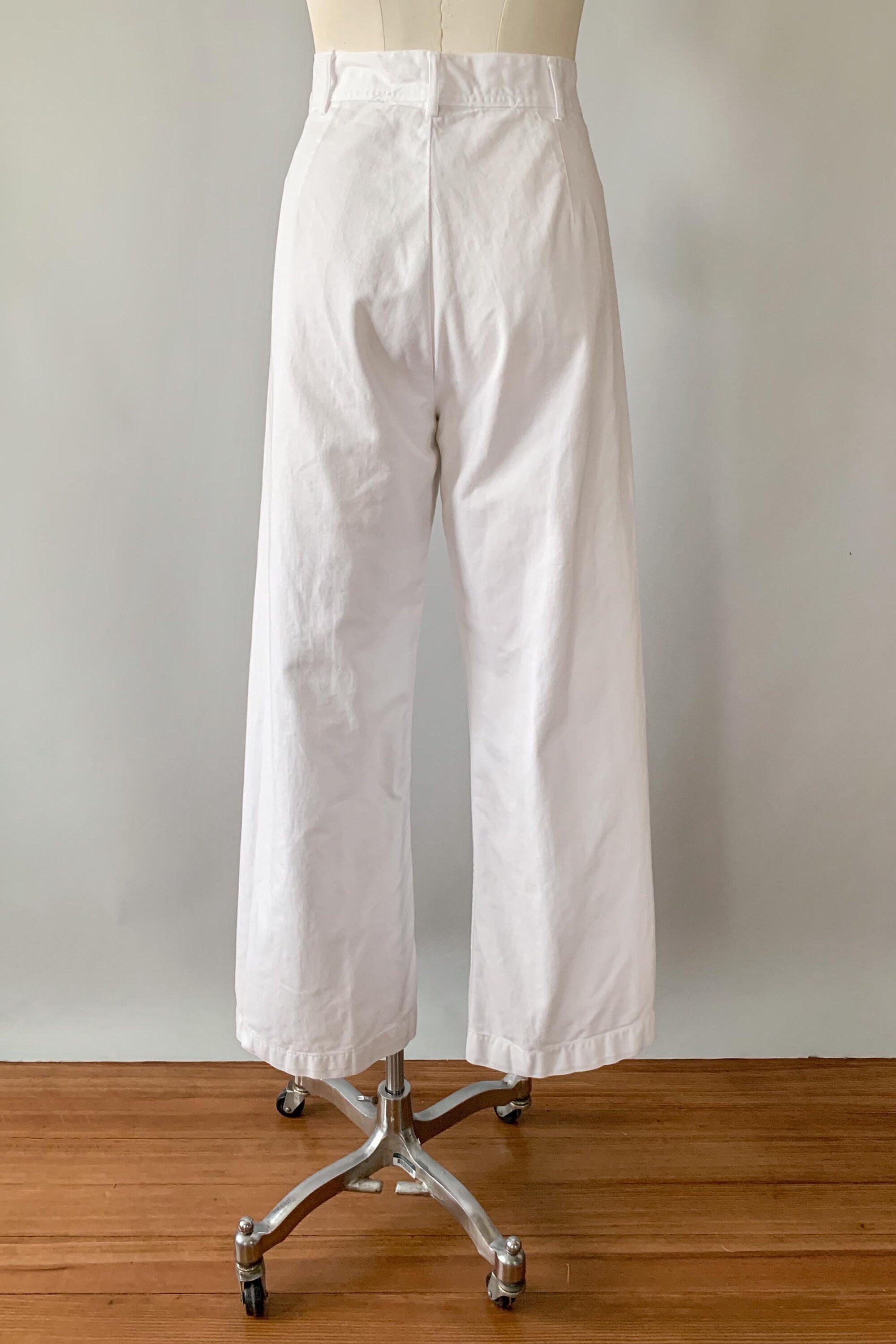 white sailor pants with gold buttons