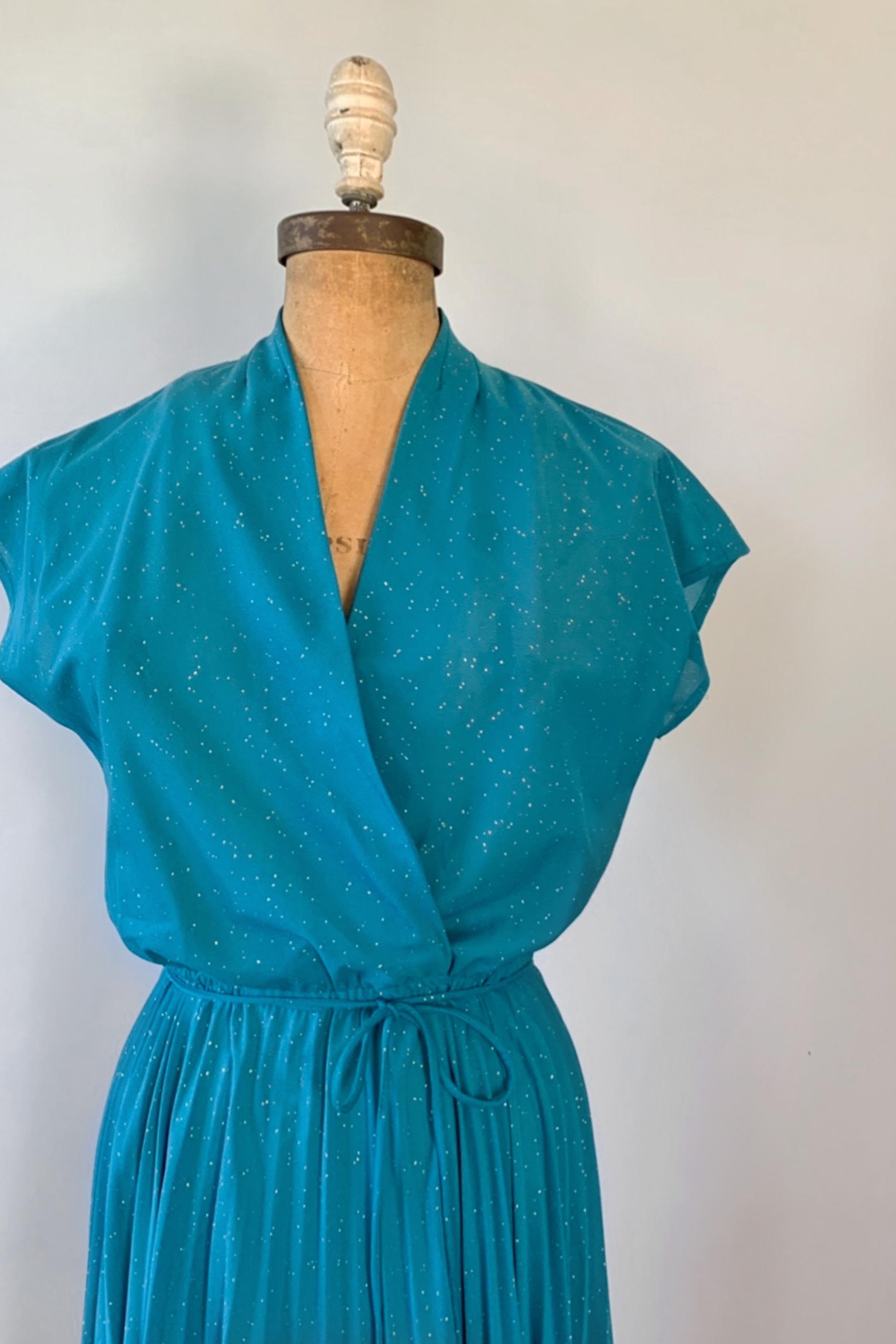 aqua long sleeve sparkle wrap gown