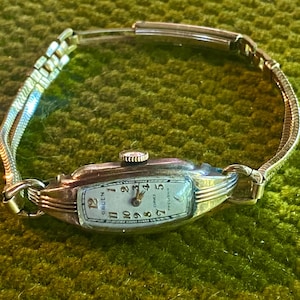 Montre ancienne Gruen Curvex : bracelet en or 12 carats - Réparation ou Bijoux