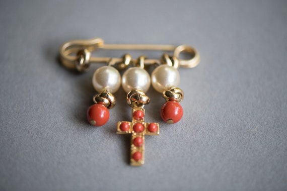 Vintage costume golden safety pin brooch, faux co… - image 1