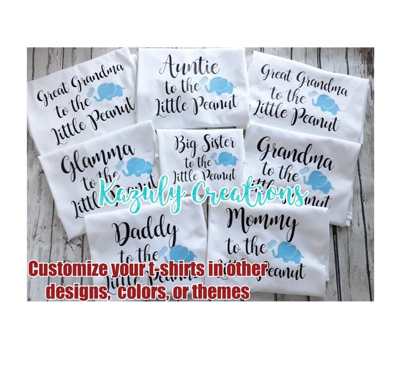May include: A set of white t-shirts with blue and black text and images of elephants. The shirts say "Great Grandma to the Little Peanut", "Auntie to the Little Peanut", "Big Sister to the Little Peanut", "Glamma to the Little Peanut", "Grandma to the Little Peanut", "Daddy to the Little Peanut", and "Mommy to the Little Peanut".