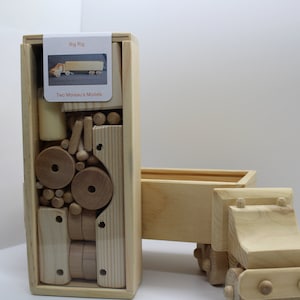 Big Rig model kit in a wood box. Everything included for hours of fun. Promote family interaction and build this with your kids