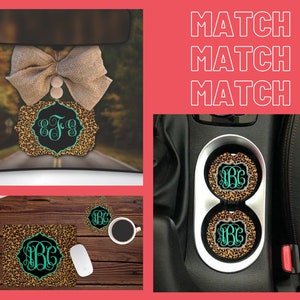 May include: A matching set of car accessories featuring a leopard print design with a monogram in a teal green colour. The set includes a car air freshener, two cup coasters, and a desk mat. The text "MATCH MATCH MATCH" is displayed in white on a pink background.