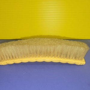 Antique Curved Bakelite Cellulite Clothes Brush with Horse Hair Bristles. circa 1900.