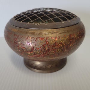 Beautiful Vintage India brass flower frog bowl with ornamental decoration to accent your decor.