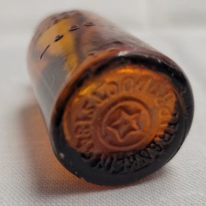 Antique Medicine Bottle by 1845 Franklin Products 6cc, 10cc, 12cc markings raised letters on the bottle.  Star in center of bottom