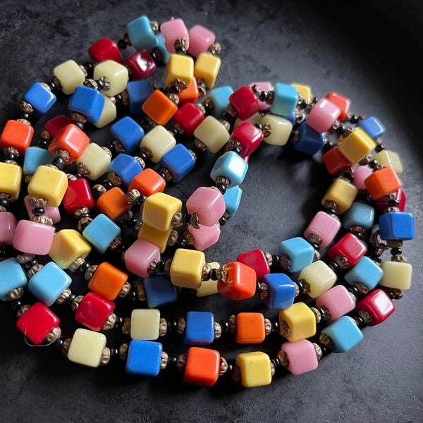 Very long strand of Czech harlequin glass cube beads in festive colors.