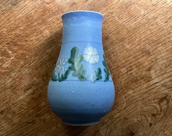 Studio pottery vase with floral decoration and matte blue glaze