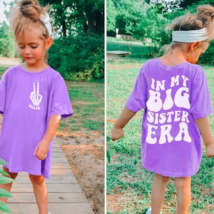 In My Big Sister Era shirt - Girls Comfort Colors® T-Shirt - Personalized Front Pocket Print with Trendy Skeleton Peace Sign and Name