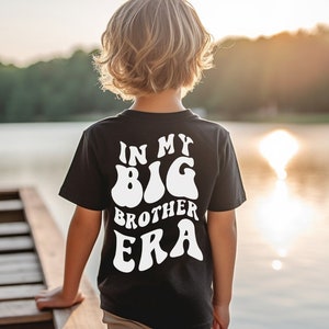 Boys Comfort Colors® T-Shirt - 'In My Big Brother Era' Back Print - Personalized Front Pocket Print with Trendy Skeleton Peace Sign and Name