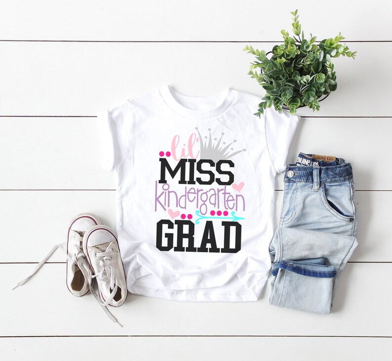 white tshirt with little miss kindergarten grad design in pink and purple with crown