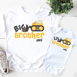 white shirts or onesies with yellow construction trucks with the design big brother little brother with personalized names