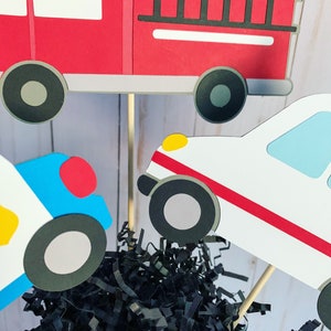 first responders emergency vehicles birthday party or baby shower centerpiece table decorations that include a firetruck, ambulance and police car