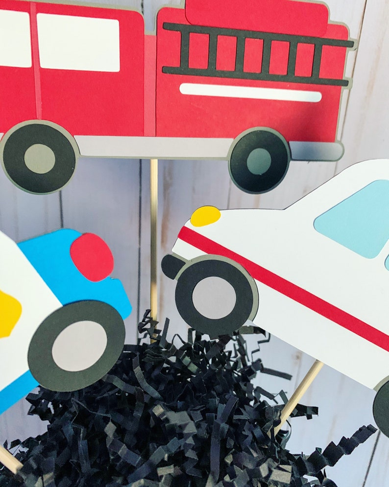 first responders emergency vehicles birthday party or baby shower centerpiece table decorations that include a firetruck, ambulance and police car