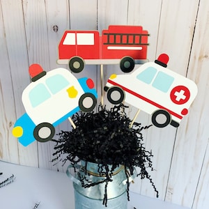 first responders emergency vehicles birthday party or baby shower centerpiece table decorations that include a firetruck, ambulance and police car