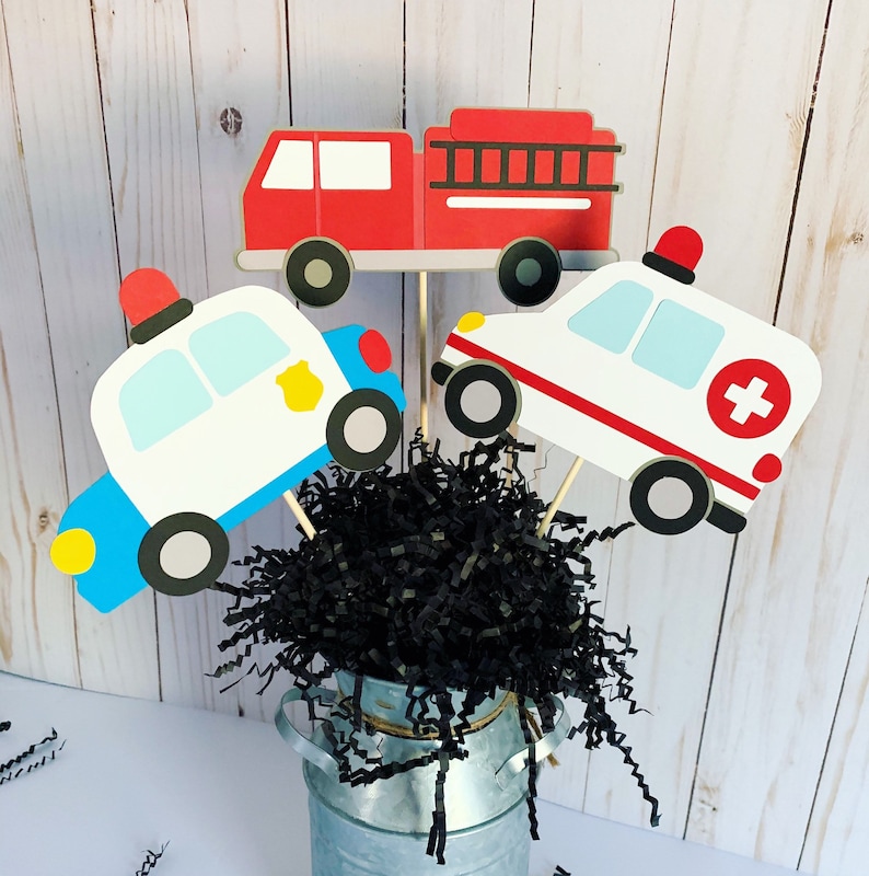 first responders emergency vehicles birthday party or baby shower centerpiece table decorations that include a firetruck, ambulance and police car