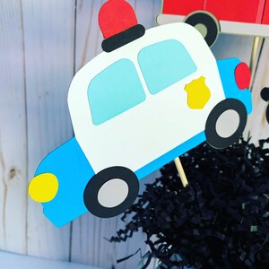 first responders emergency vehicles birthday party or baby shower centerpiece table decorations that include a firetruck, ambulance and police car