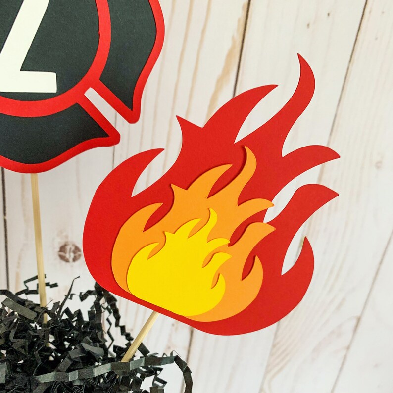 firefighter centerpiece birthday decorations featuring a firetruck, emblem with age, flame, fire hydrant, dalmatian and fire extinguisher