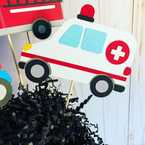 first responders emergency vehicles birthday party or baby shower centerpiece table decorations that include a firetruck, ambulance and police car