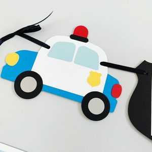 first responders emergency vehicle happy birthday banner featuring police car and badges, EMT ambulance and emblem, firetruck and fire emblem