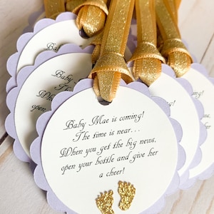 pink and gold baby shower favor tags for mini champagne bottles