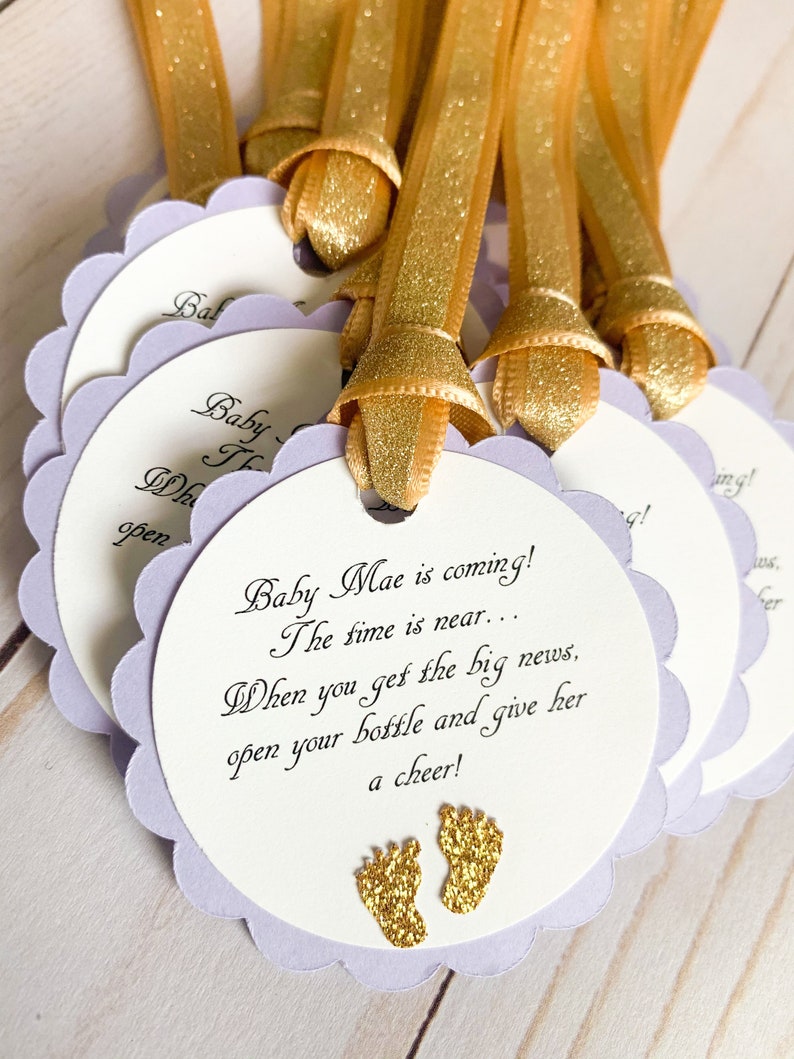 pink and gold baby shower favor tags for mini champagne bottles