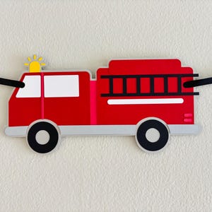 firetruck party decorations featuring firetruck, fire hydrant, fire extinguisher, flame and dalmatian