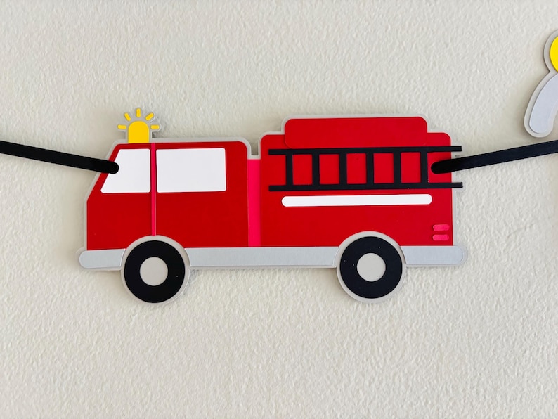 firetruck party decorations featuring firetruck, fire hydrant, fire extinguisher, flame and dalmatian