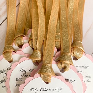 pink and gold baby shower favor tags for mini champagne bottles