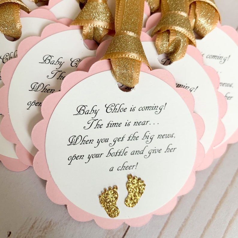 pink and gold baby shower favor tags for mini champagne bottles
