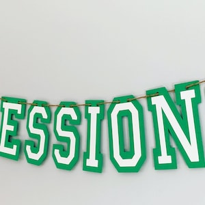 football concessions banner featuring varsity letters and two footballs that will be perfect for your little one's football themed birthday party, super bowl game day party, sports team party or to hang on your schools concession stand during football season. The banner is fully customizable.