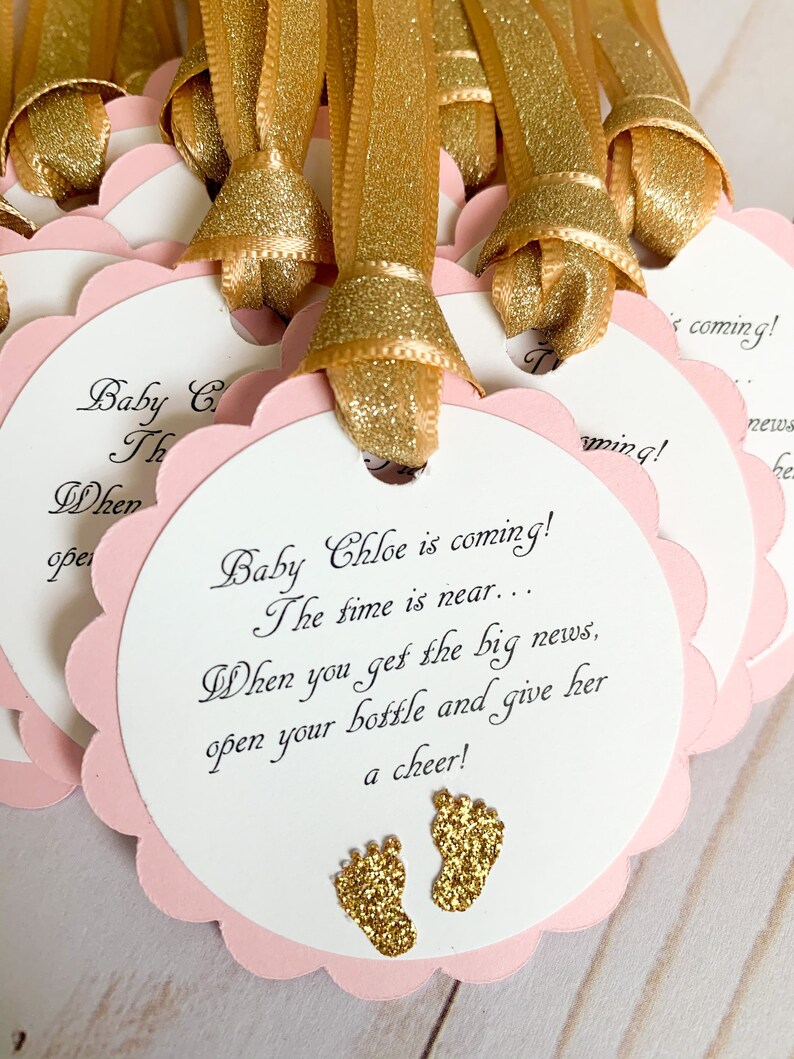 pink and gold baby shower favor tags for mini champagne bottles