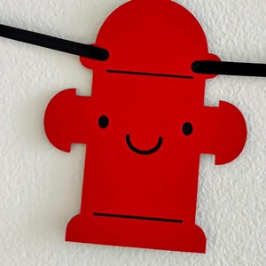 firetruck party decorations featuring firetruck, fire hydrant, fire extinguisher, flame and dalmatian